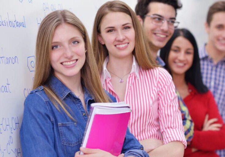 happy young teens group in school have fun an learning lessons