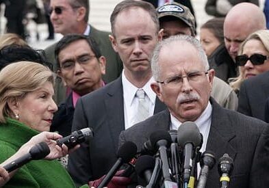 Mark Janus (center) with his National Right to Work Foundation Attorney William Messenger (left) after his winning argument before the U.S. Supreme Court.