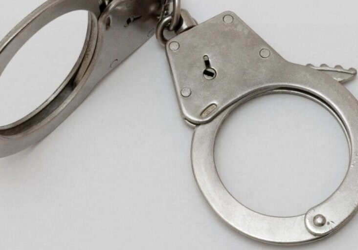 Close up shot of a handcuff with a white background