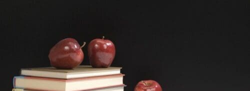 Some small size apples kept on the book